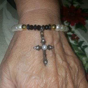 A pearl cross bracelet